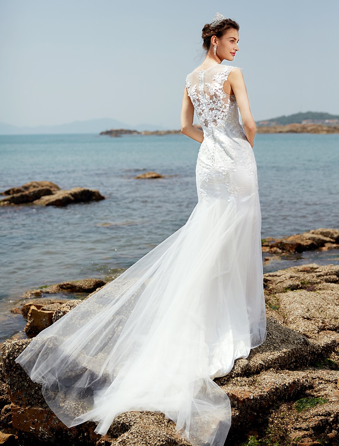 Back view of a mermaid trumpet wedding dress showing sweep train.