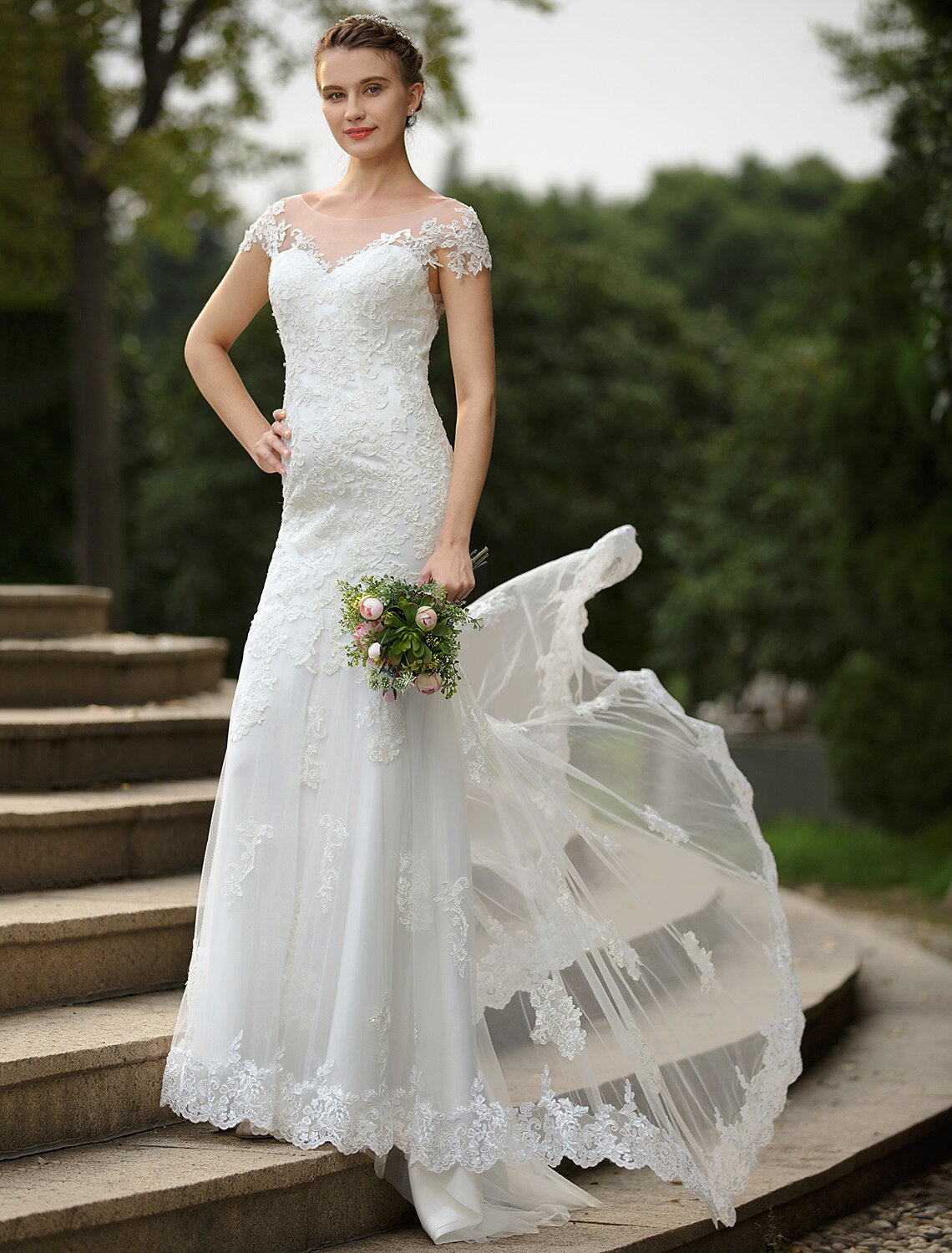 Flowing sweep train of the mermaid wedding gown.