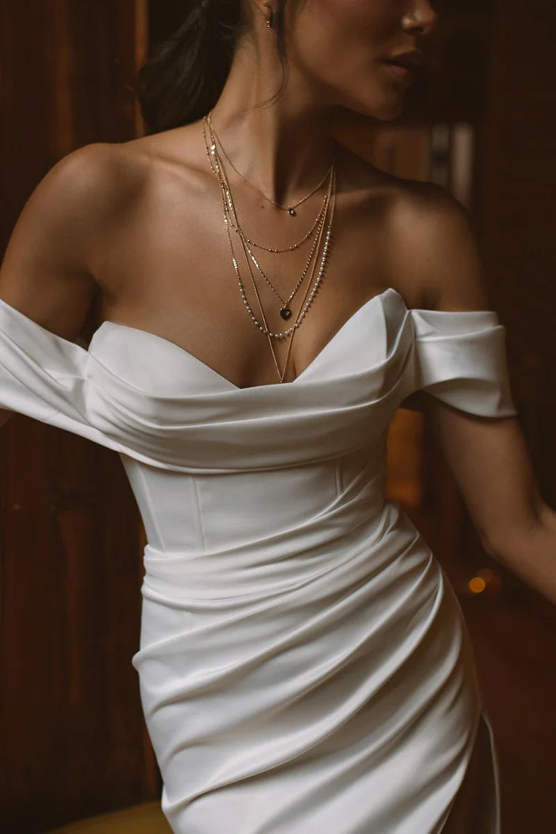 Back view of the mermaid trumpet boho wedding dress, highlighting the silhouette and fabric details.