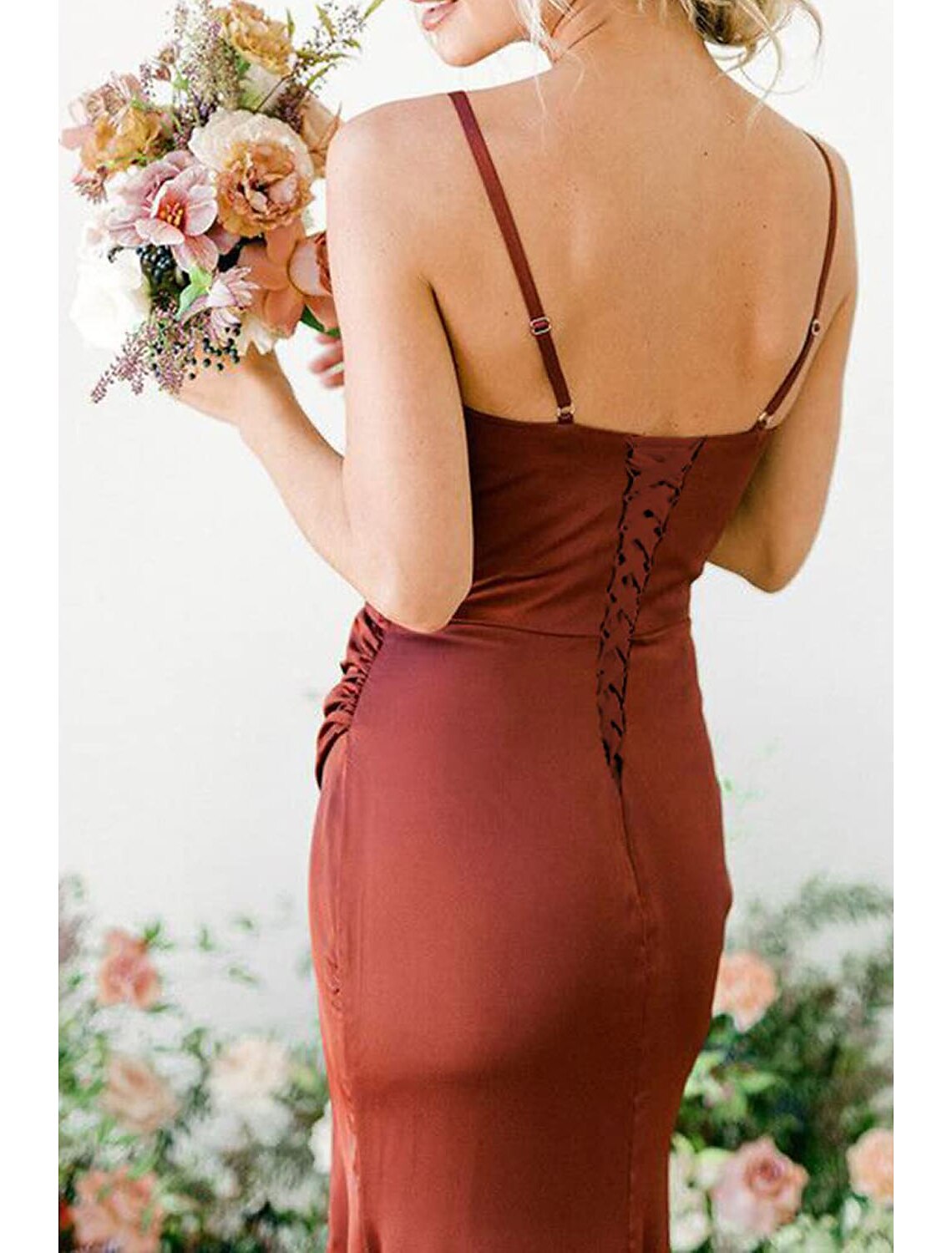 Close-up of the cowl neckline and spaghetti straps on the bridesmaid dress.