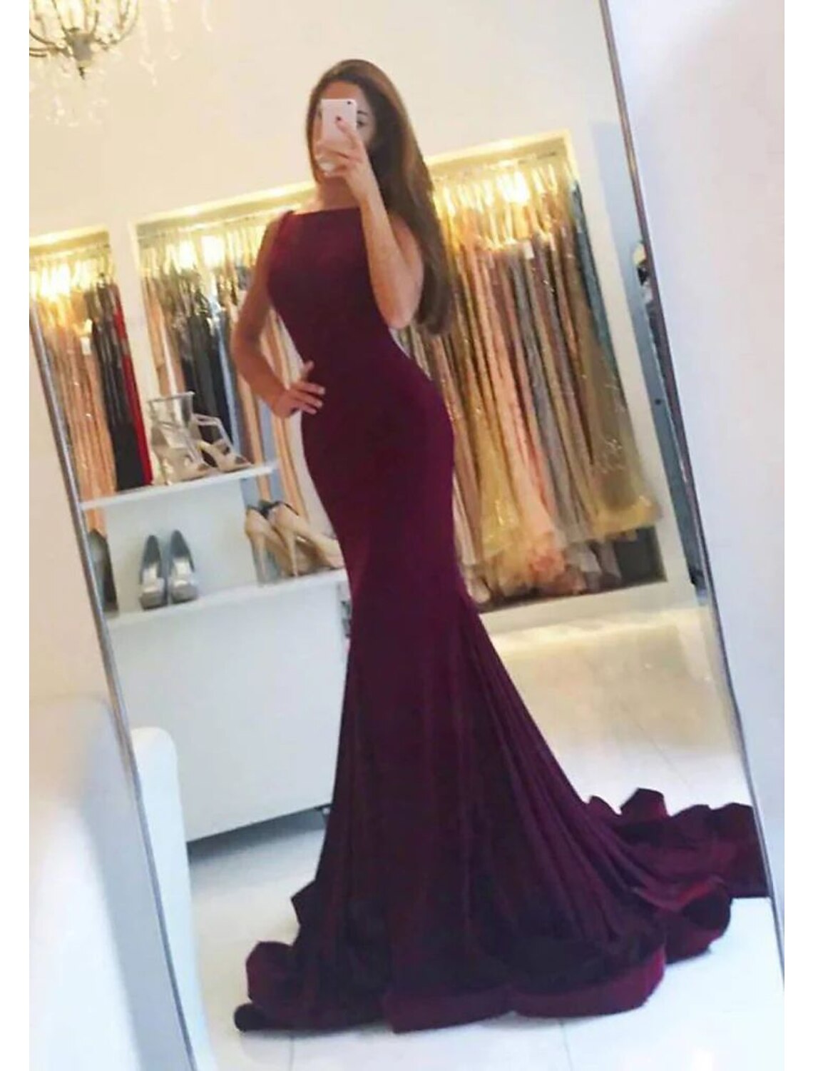 Elegant Mermaid Trumpet Evening Gown with spaghetti straps and pleats.