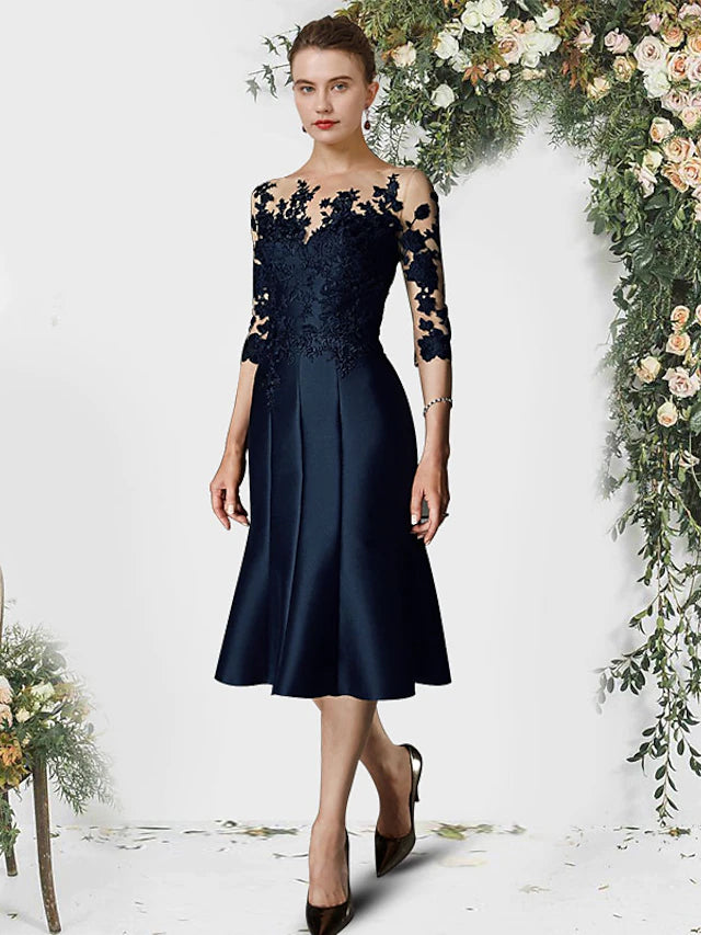 Elegant Mother of the Bride gown with mermaid trumpet silhouette, jewel neck, and half sleeves.
