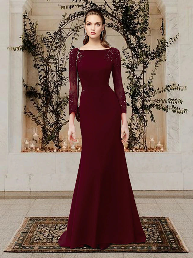 Elegant Mermaid Trumpet Mother of the Bride dress with jewel neck, long sleeves, and appliques.
