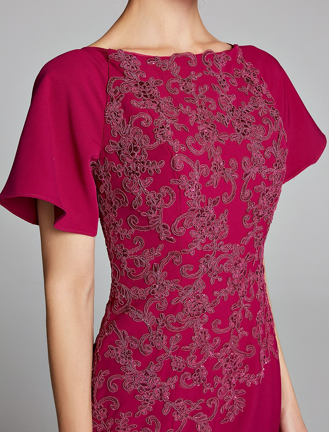 Close-up of the chiffon lace detail on the Mermaid Trumpet dress sleeve.
