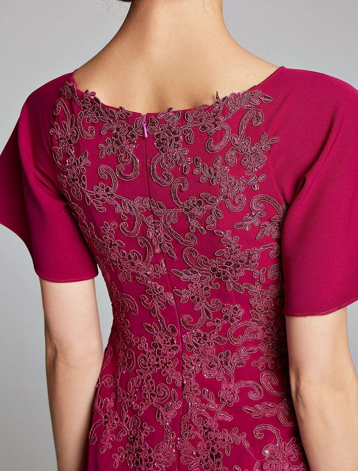 Side view of the Mermaid Trumpet dress, highlighting the split front detail.
