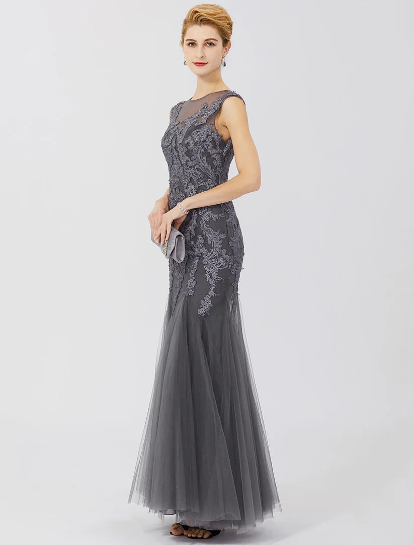 Detail of the lace and pleats on the skirt of the elegant Mother of the Bride dress.