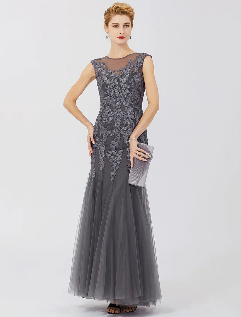 Side profile of the luxurious lace and tulle Mother of the Bride gown with a flowing train.