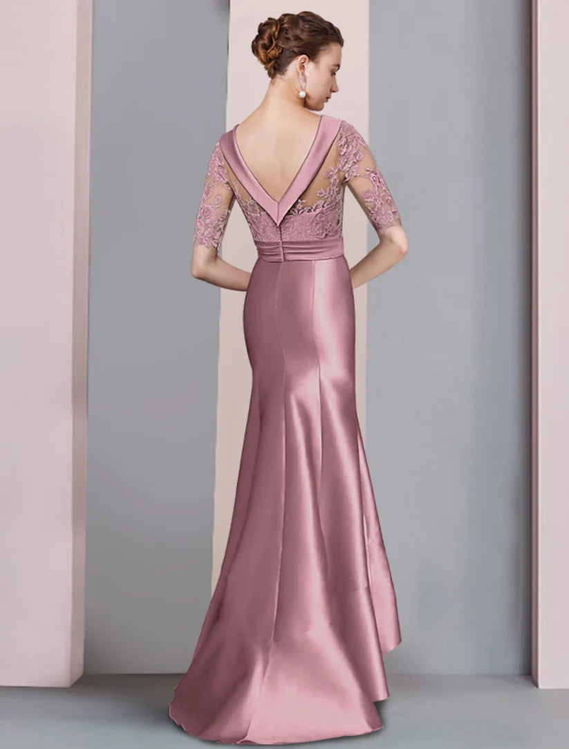 Back view of the satin and lace mermaid trumpet dress with sweep train.