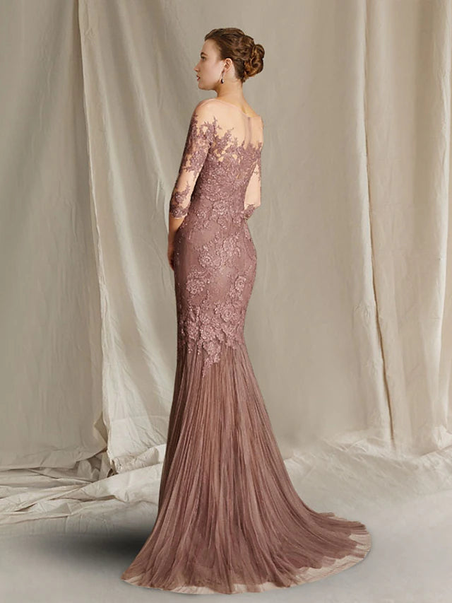 Back view of the mermaid trumpet Mother of the Bride dress featuring a sweep train and delicate lace details.