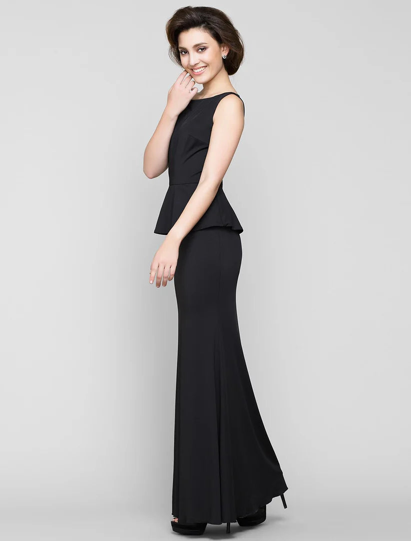 Back view of an elegant navy ankle-length mermaid trumpet dress on a model.