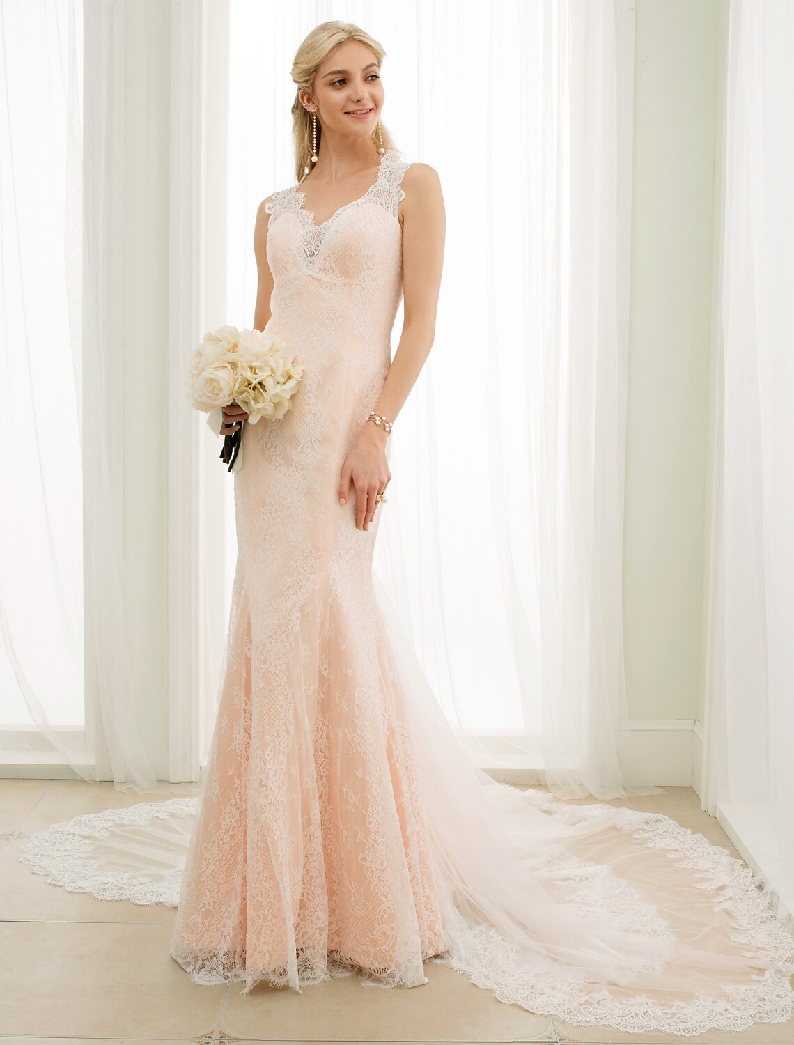 Detail of the lace and fabric texture on the Mermaid Trumpet wedding dress.