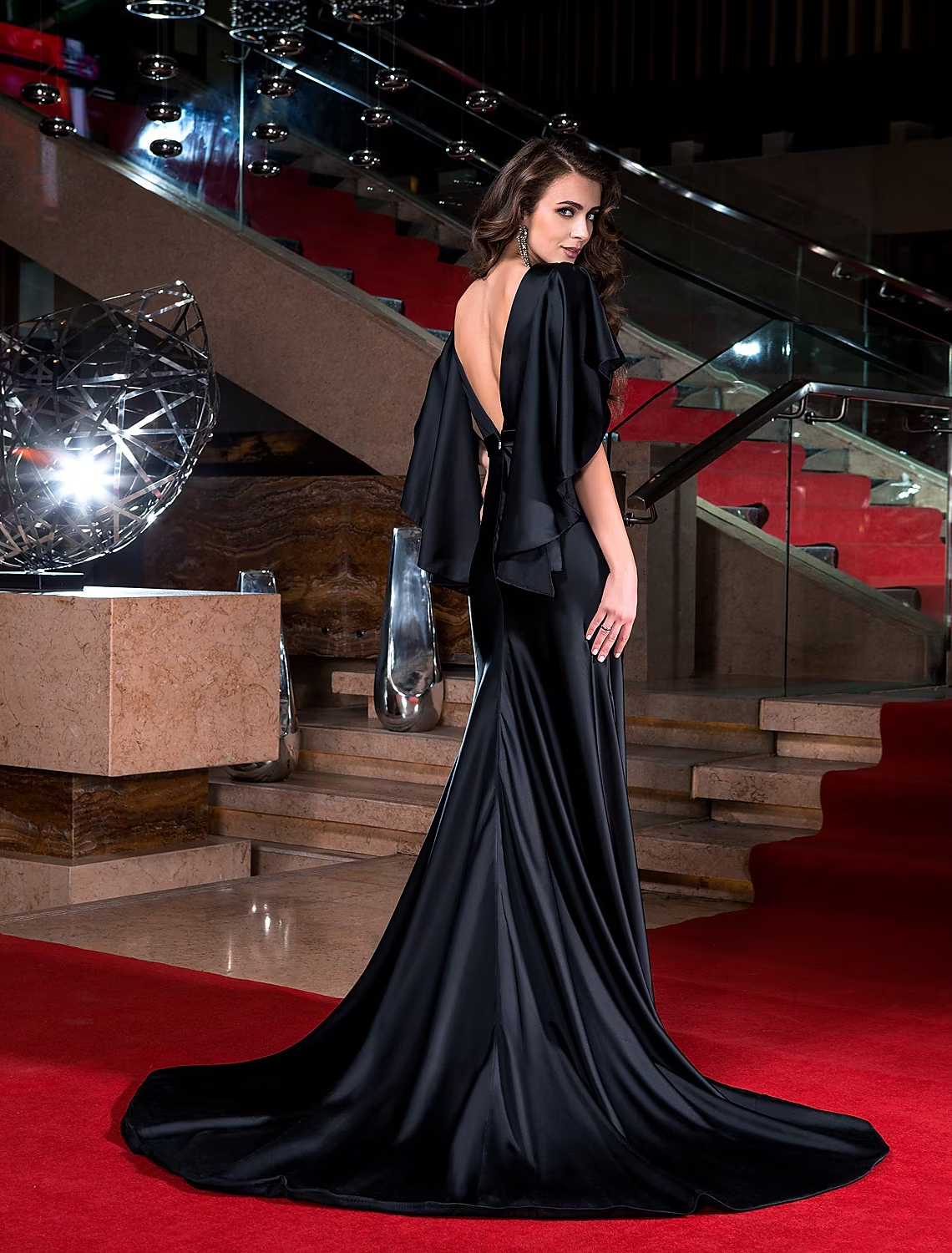 Back view of the formal dress with V-back and crystal embellishments.
