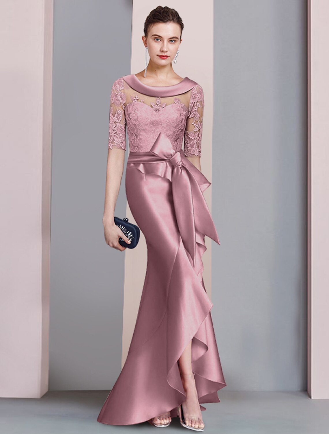 Woman wearing an elegant navy Mermaid Trumpet dress with a scoop neck and half sleeves.