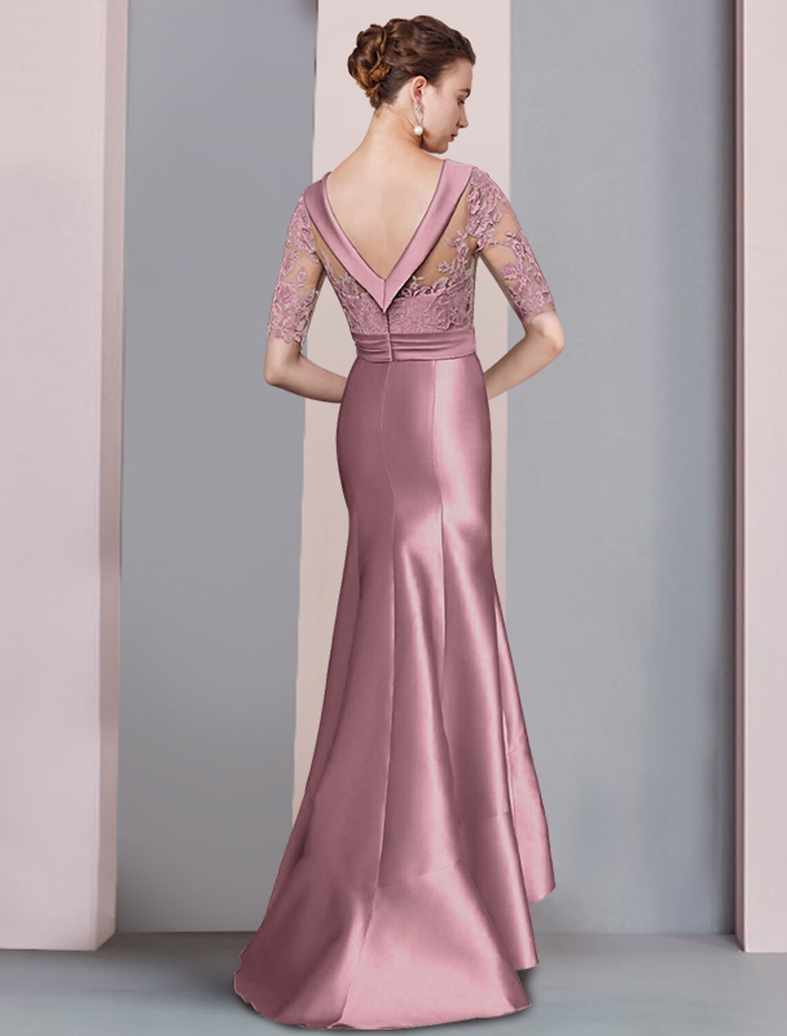 Back view of the navy Mermaid Trumpet dress, showcasing the sweep train and asymmetrical design.