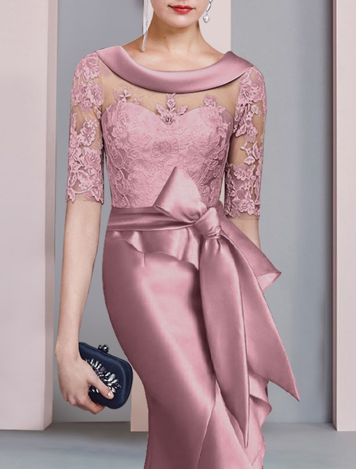 Side view of the navy high-low formal dress, highlighting the satin and lace details.