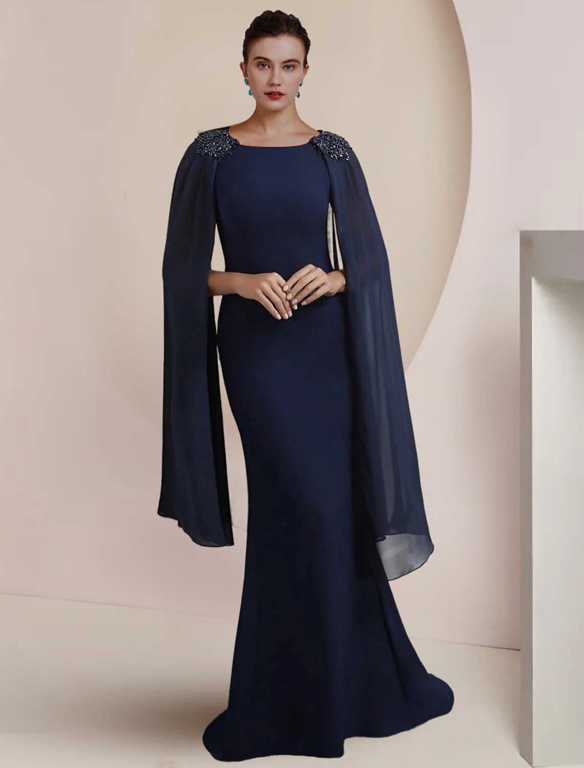 Elegant mermaid trumpet mother of the bride dress with scoop neck and beading.