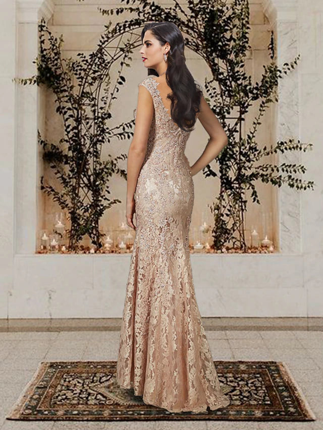 Back view of the floor-length lace Mother of the Bride gown with delicate appliques.