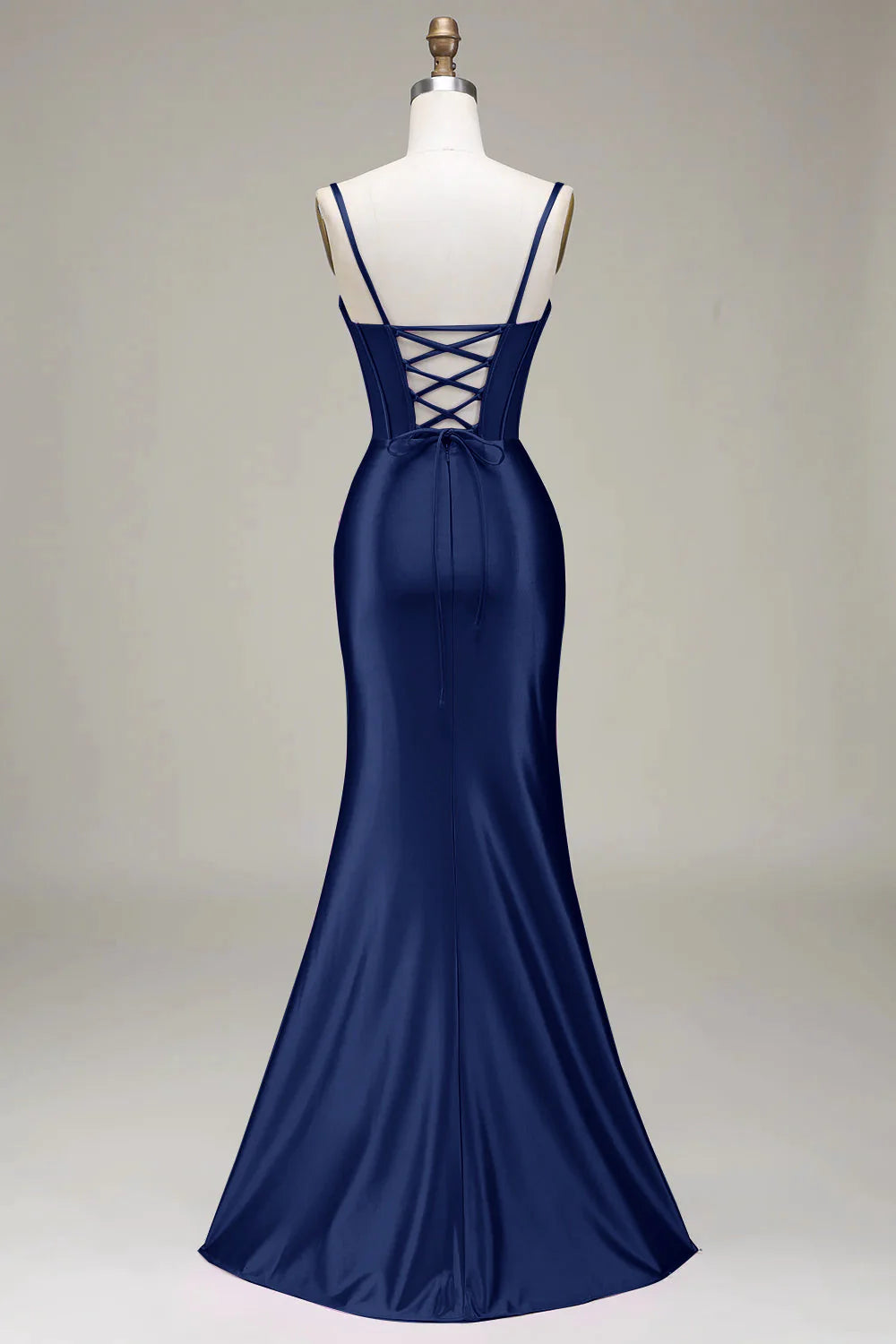 Dark green formal mermaid dress featuring a backless design.