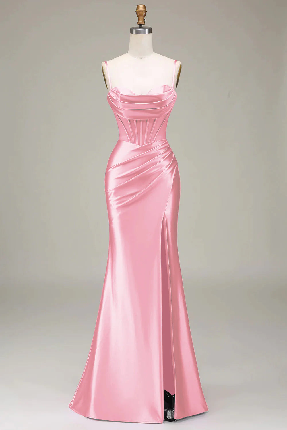 Model wearing a mermaid trumpet gown in a studio setting.