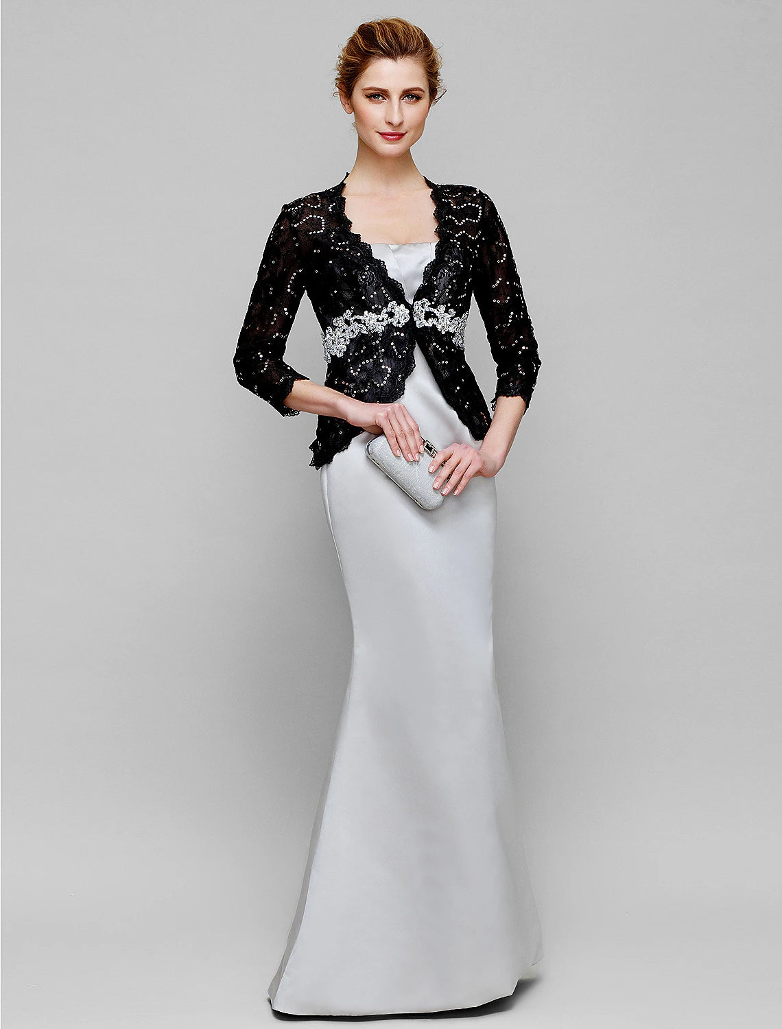 Elegant strapless mermaid trumpet gown with lace and beading.