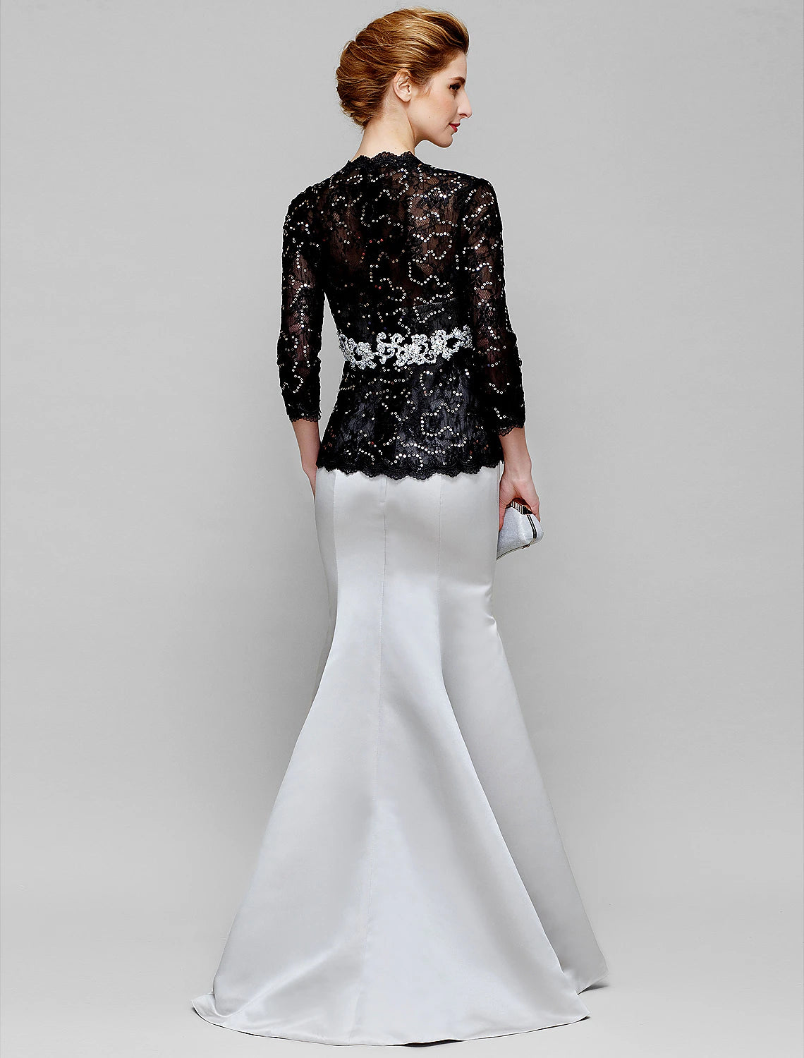 Bodice detail of convertible gown with delicate lace sleeves.