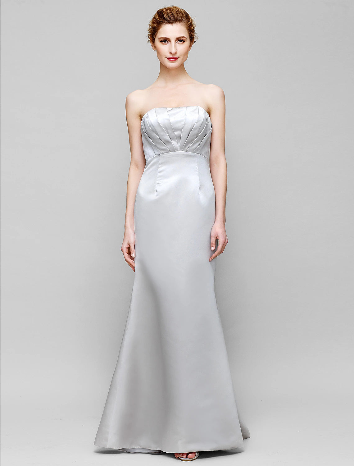 Back view of floor-length mermaid trumpet dress.
