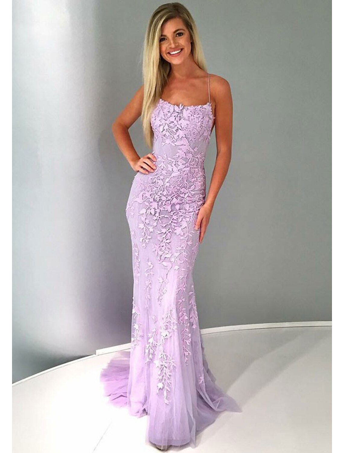Elegant strapless mermaid trumpet prom dress with lace appliques and a court train.