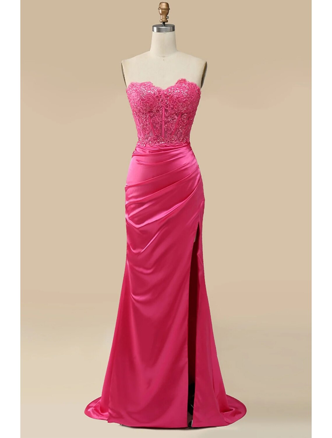 Model wearing an elegant sweetheart neckline mermaid trumpet prom dress with appliques and a sweep train.