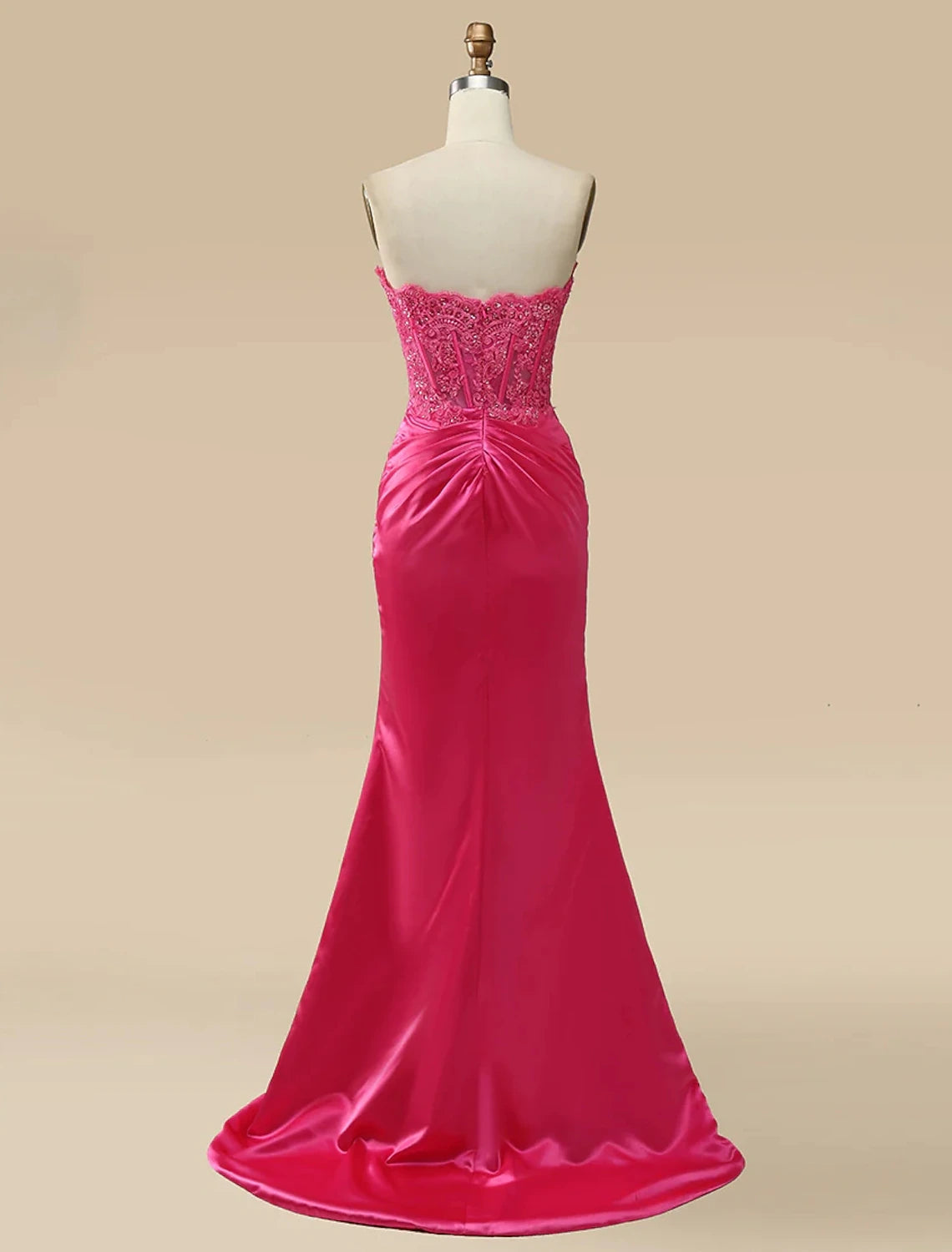 Close-up of the sweetheart neckline and delicate appliques on the mermaid trumpet prom dress.
