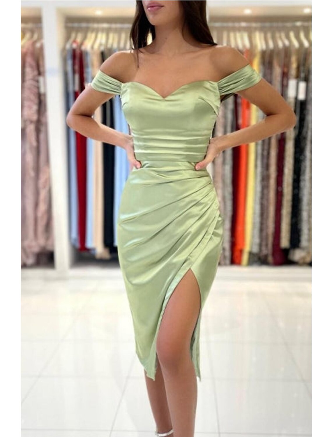 Side view of a tea length charmeuse cocktail dress.