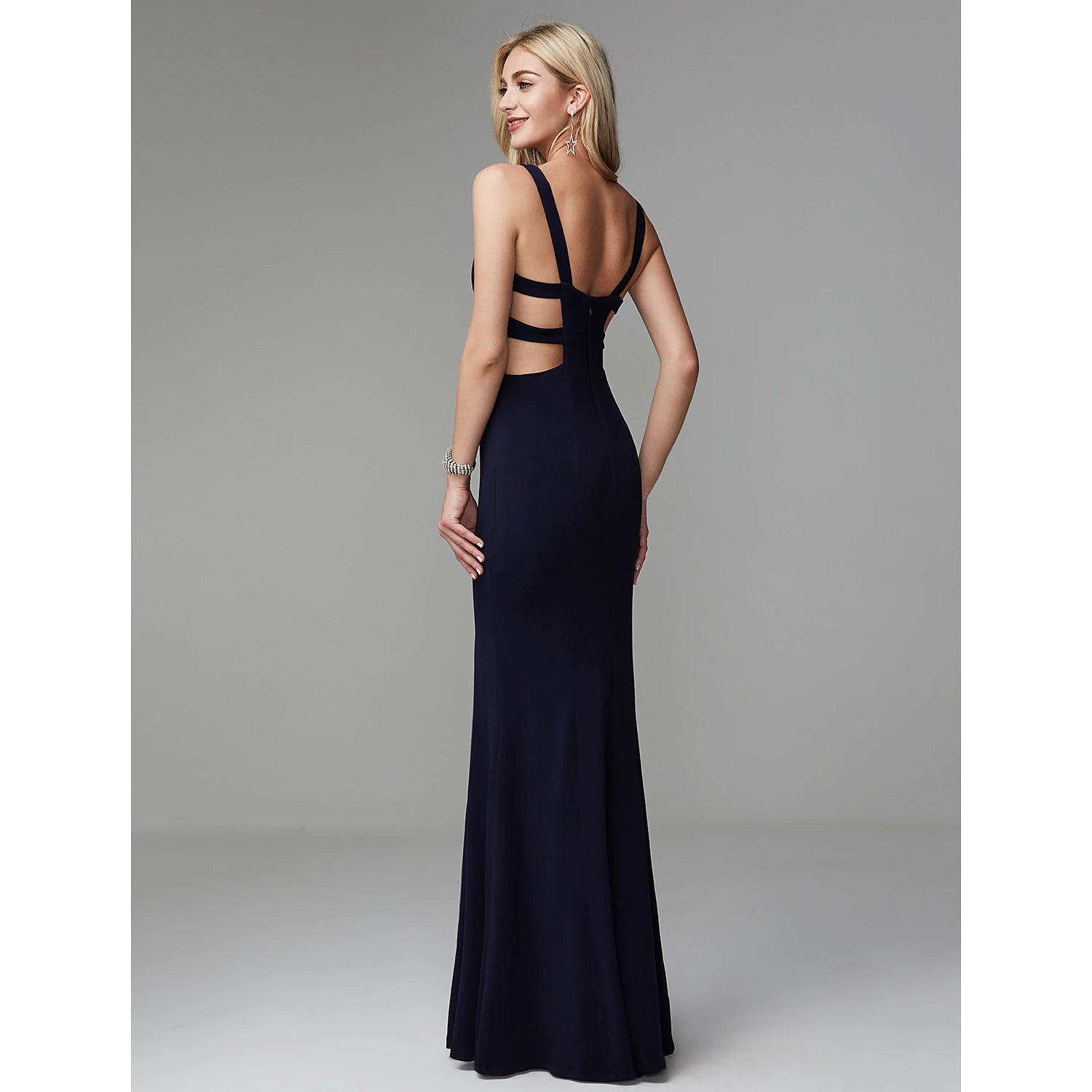 Side profile of floor-length formal gown.