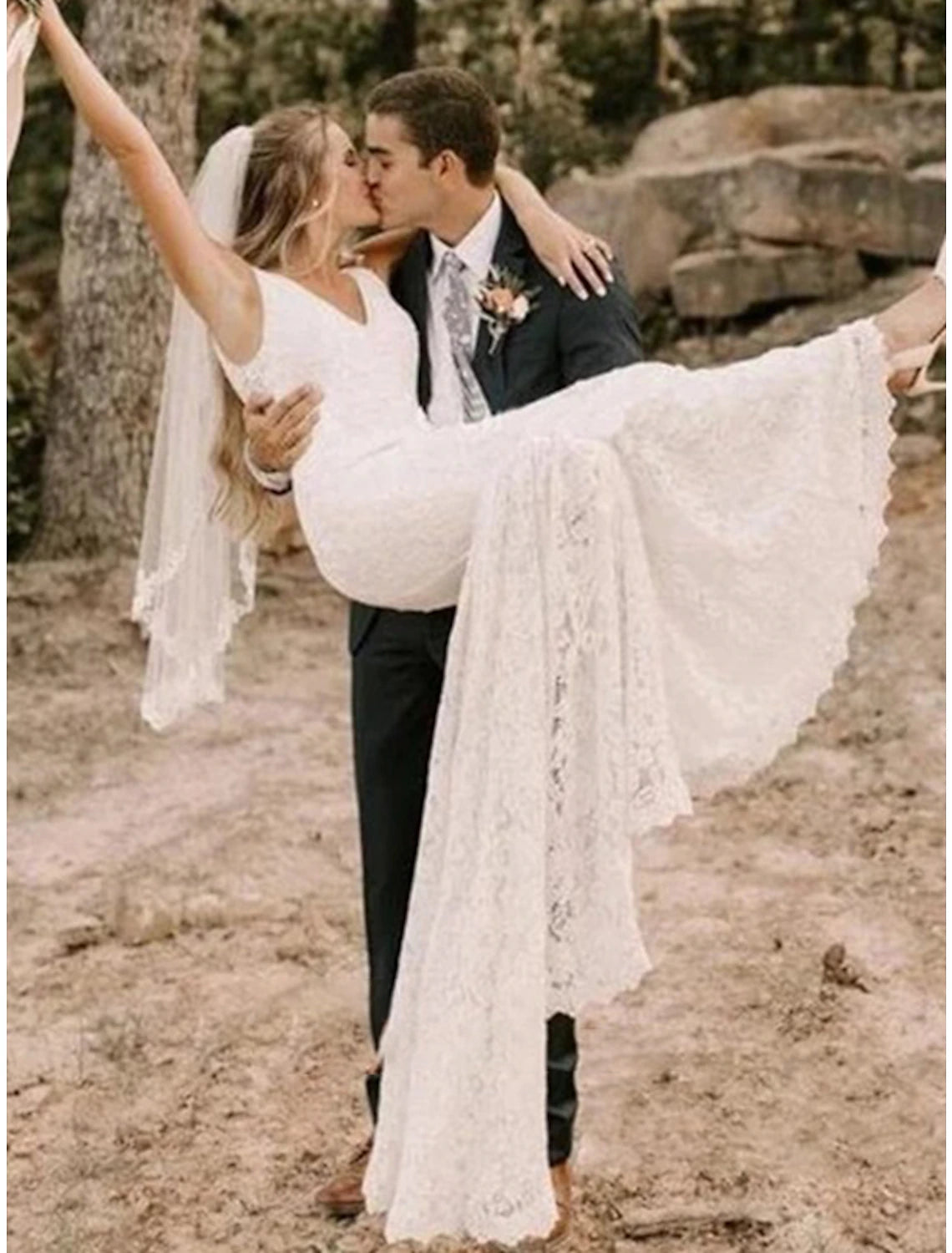 Elegant mermaid trumpet wedding dress with V-neck, lace, and embroidery, featuring a court train.