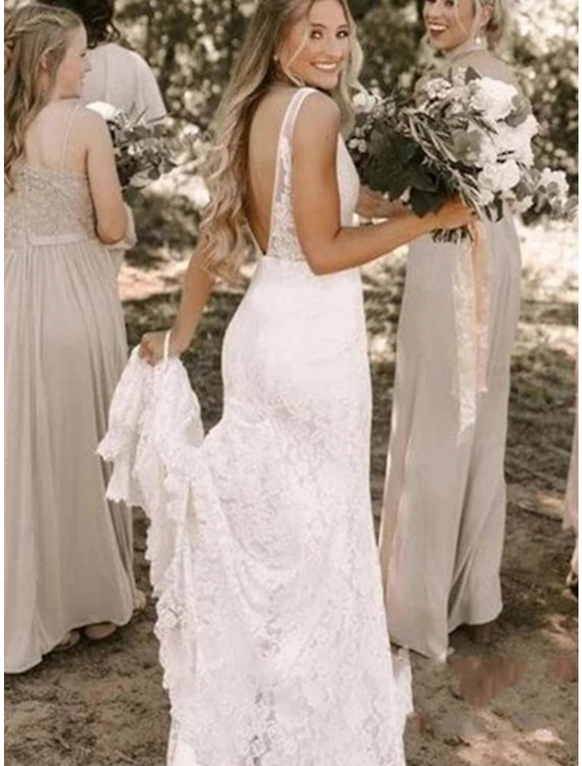 Side view of a sleeveless mermaid wedding gown, highlighting its silhouette.