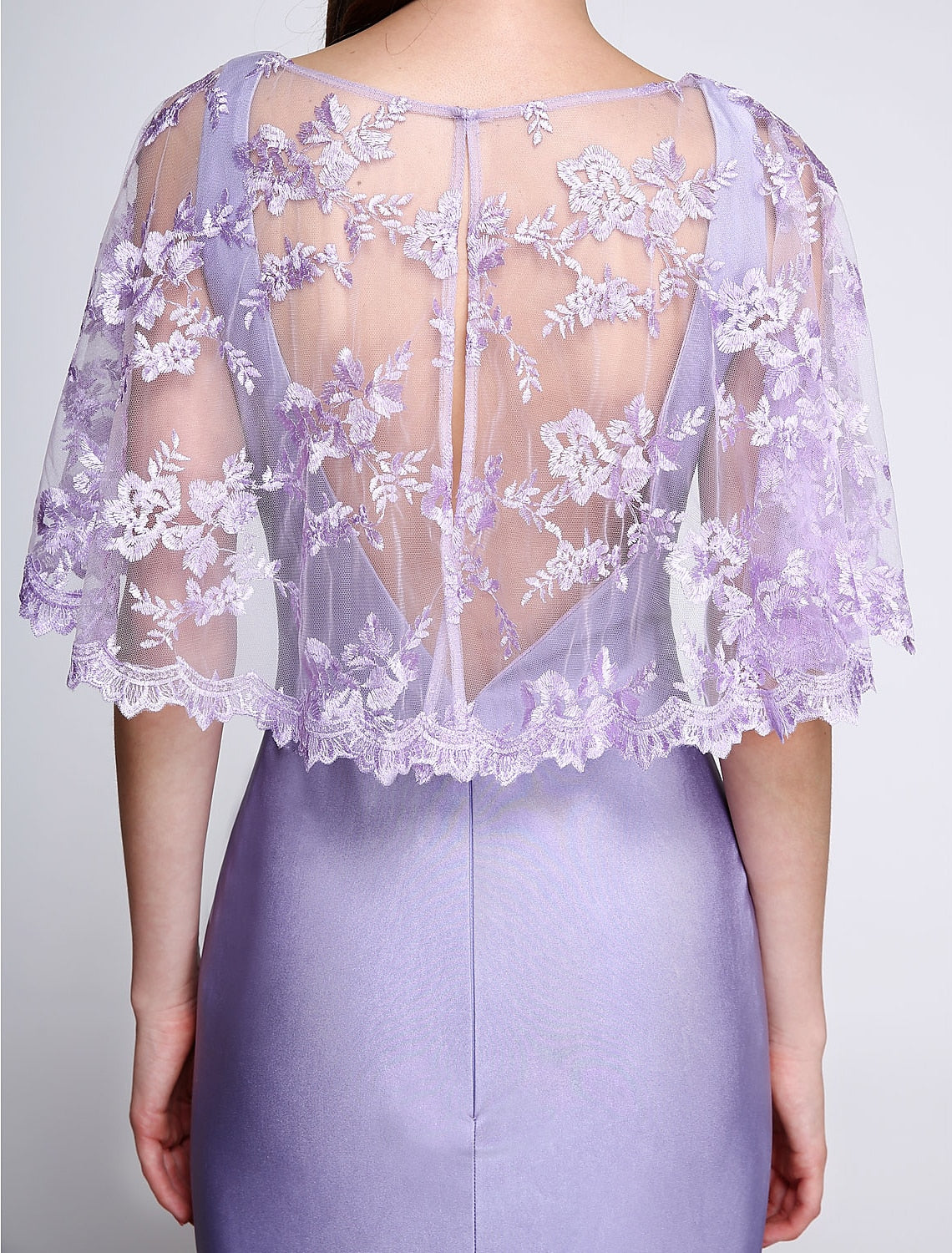 Detail of the V-Neckline and sleeveless design of the formal gown.