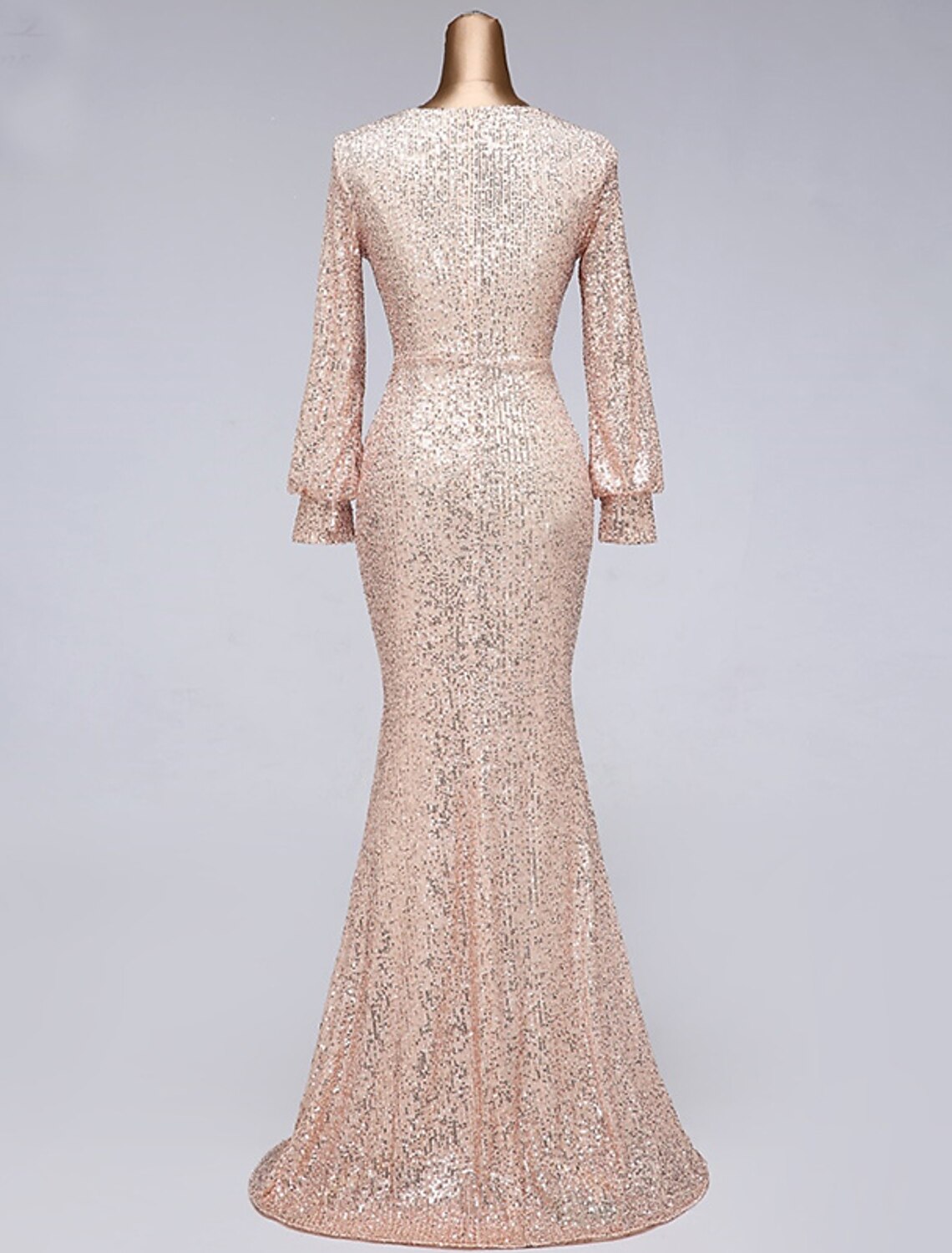 Close-up of sequin detailing on tulle fabric of evening dress.