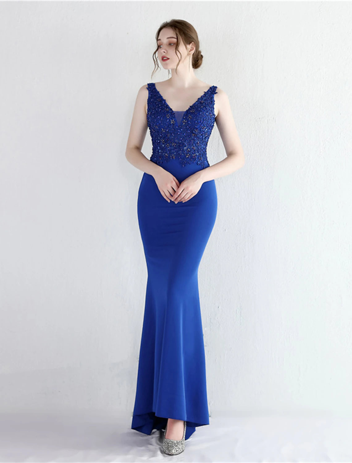 Side profile of the Mermaid Trumpet dress, showcasing its elegant silhouette.