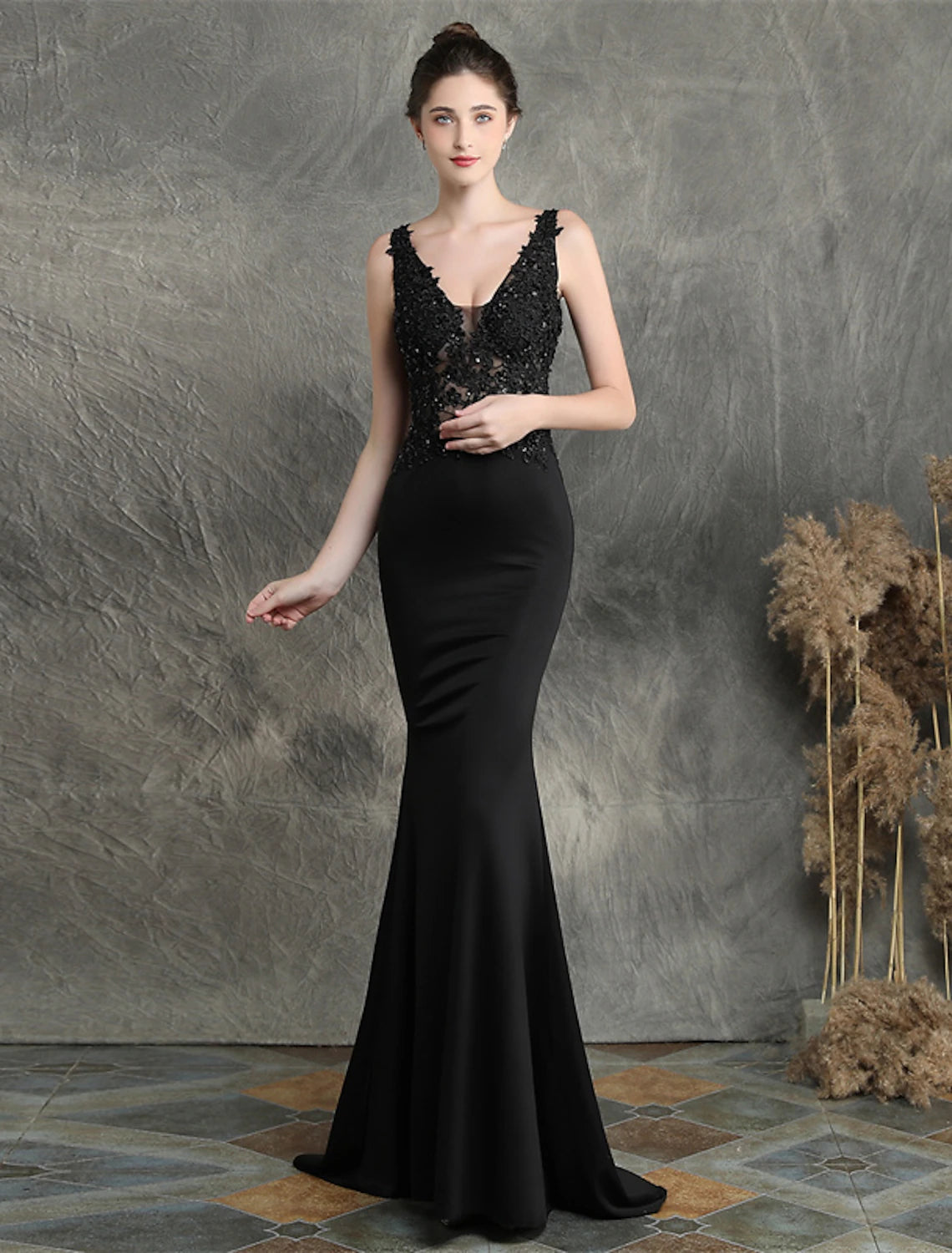 Mermaid Trumpet gown from the back, featuring the open design and train.