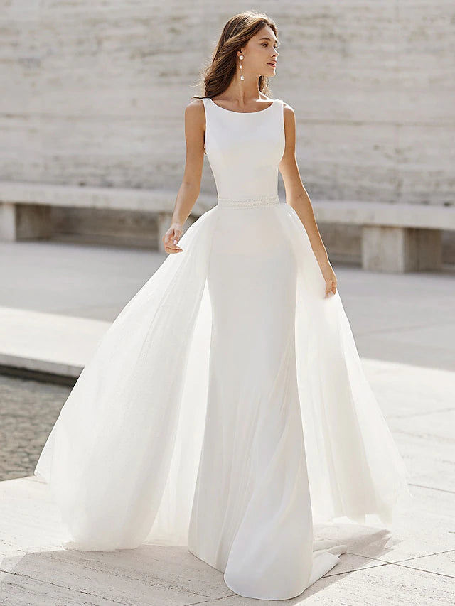 Elegant satin mermaid wedding dress with V-neck and open back.