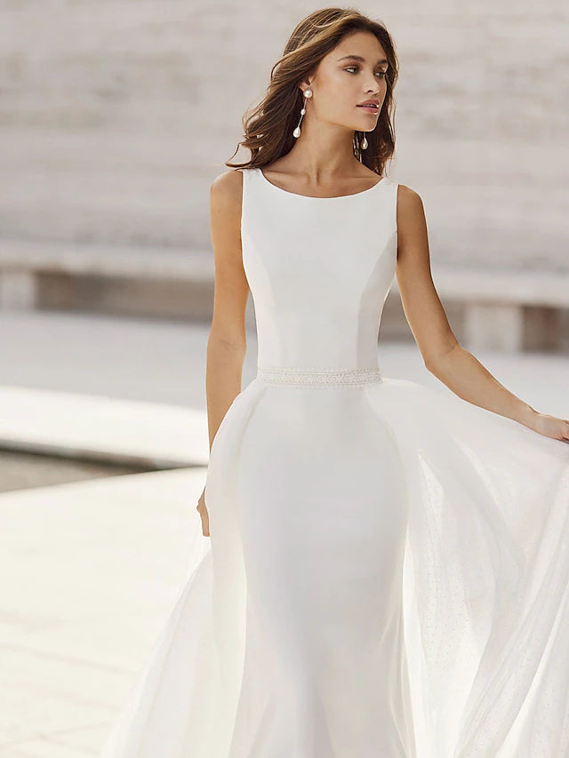 Back view of mermaid wedding dress showing court train and appliques.