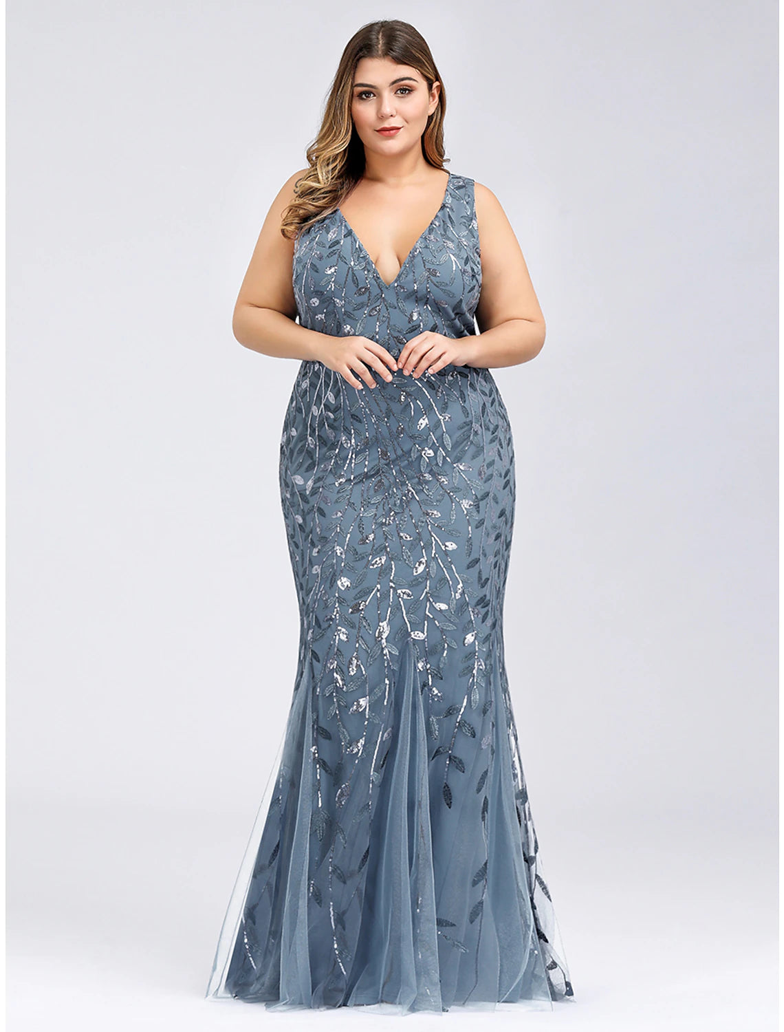 Back view of plus size mermaid trumpet evening gown with V-back and appliques.