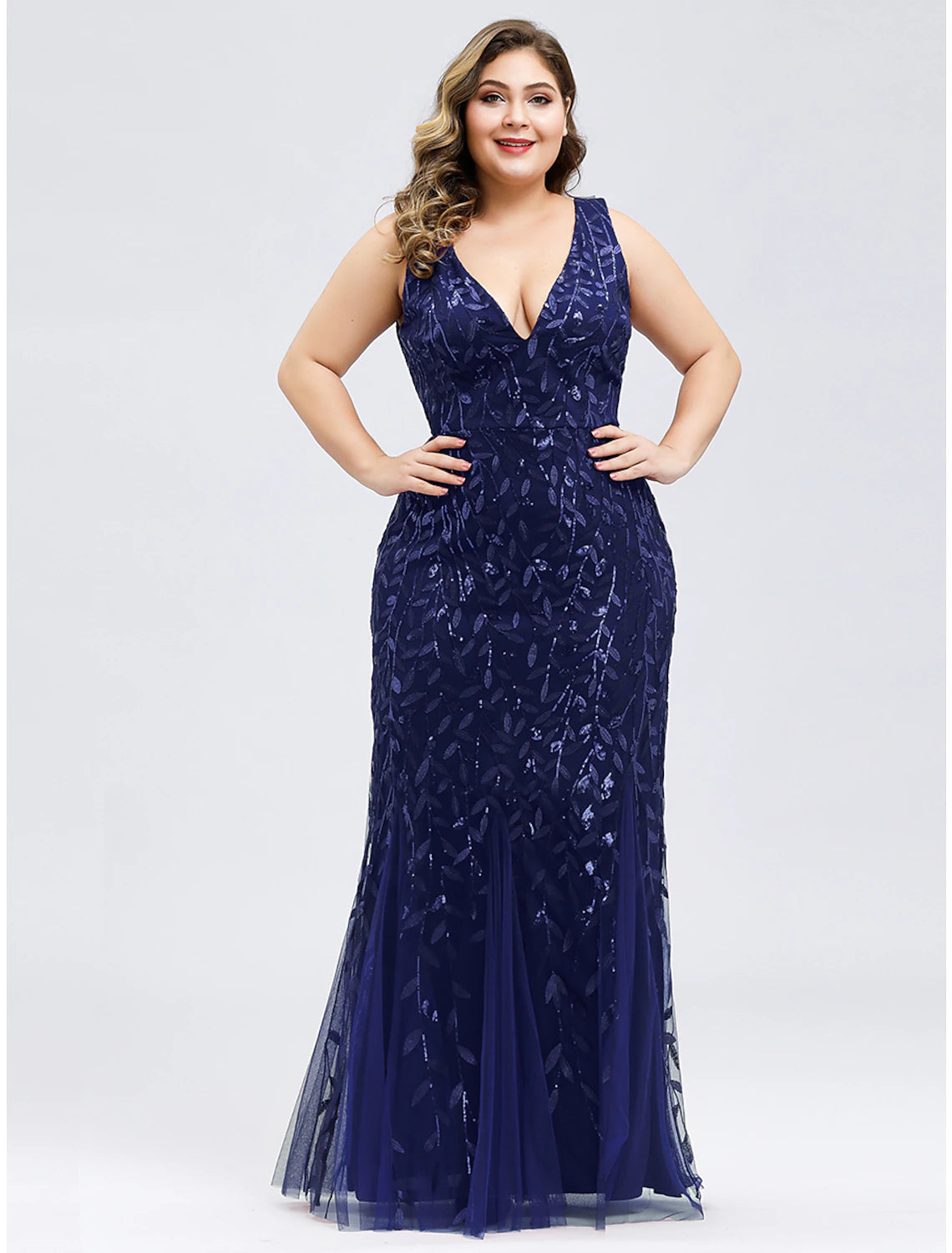 Side profile of elegant plus size mermaid trumpet dress.
