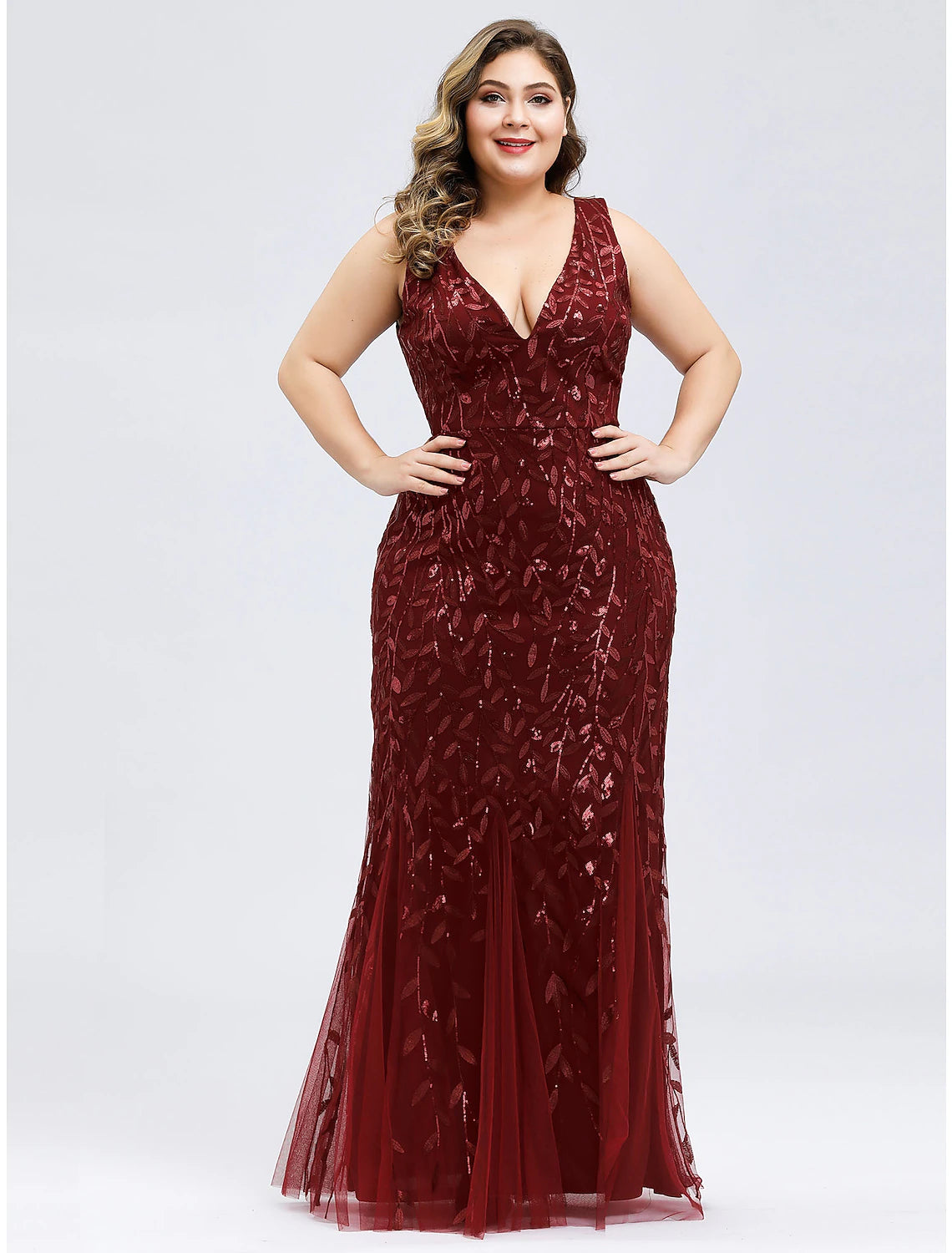 Close-up of delicate lace appliques on V-neck evening gown.