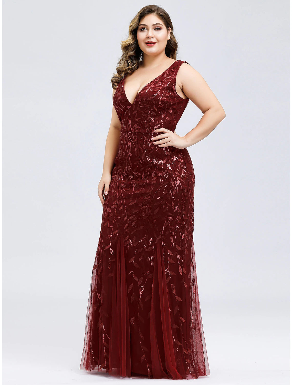 Sleeveless V-neck plus size dress with floor-length design.