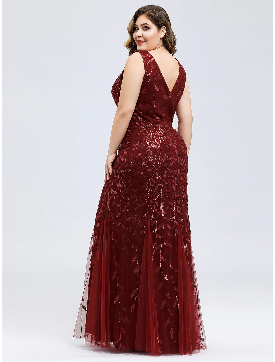 Detail of floor-length hem and appliques on mermaid trumpet gown.