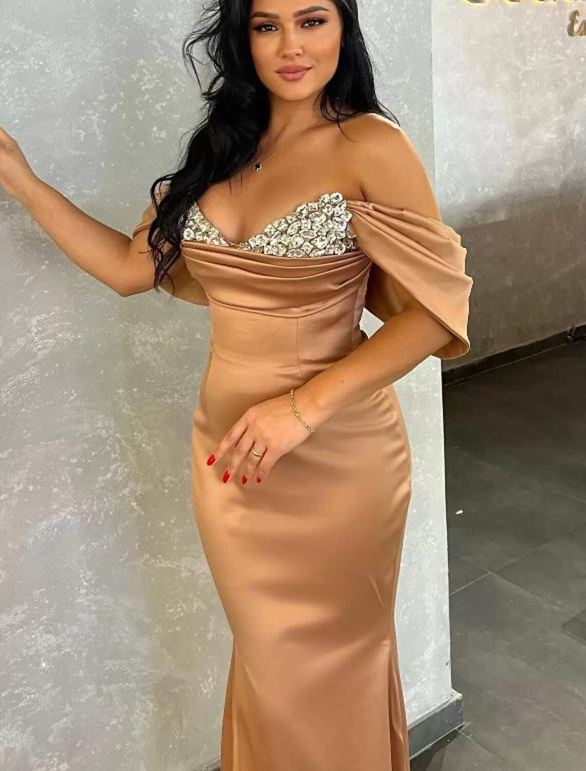 Elegant mermaid trumpet V-neck evening gown with ruched bodice and sweep train.