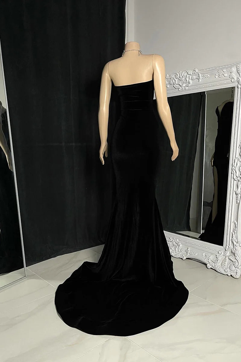 Elegant velvet mermaid prom dress with a strapless neckline and court train.