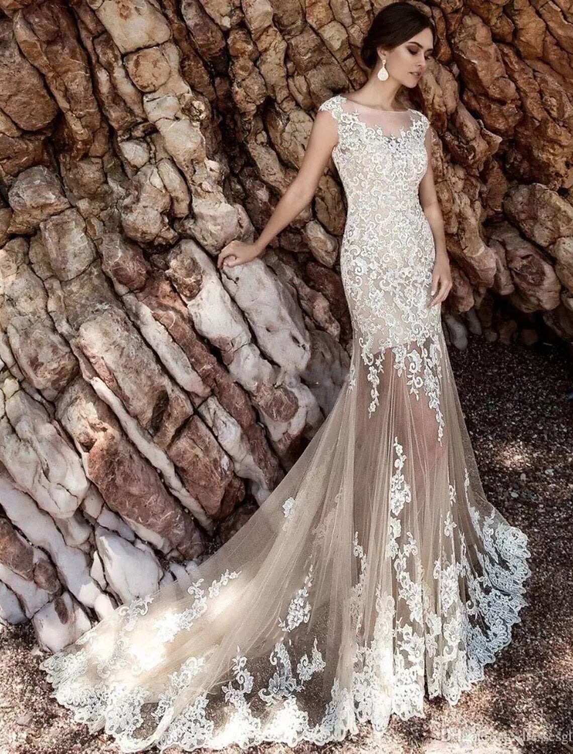 Side view of the mermaid trumpet wedding dress, highlighting its silhouette and lace embellishments.