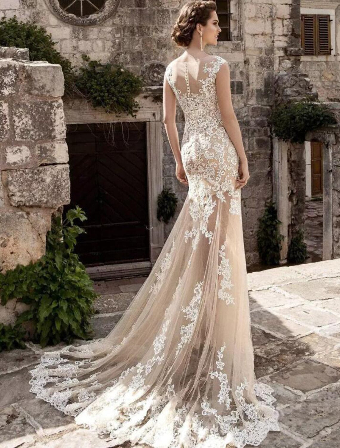 Full length view of the formal wedding dress, showcasing its elegant design and flowing train.