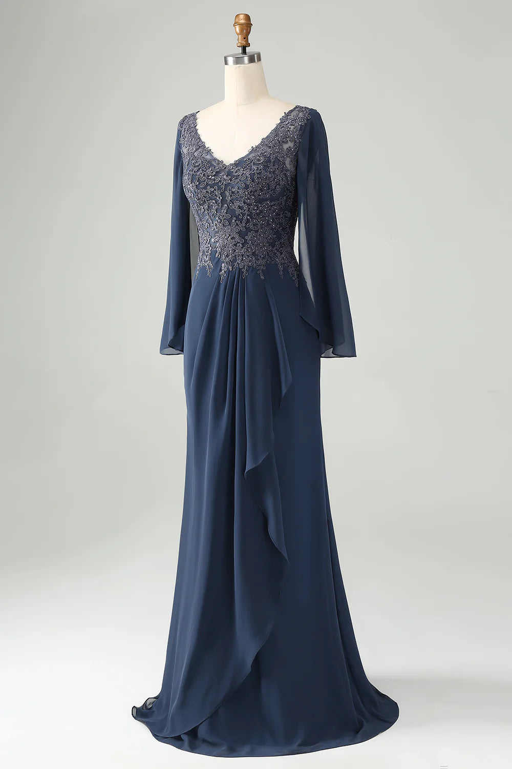 Close-up of delicate beading and appliques on the V-neck dress.