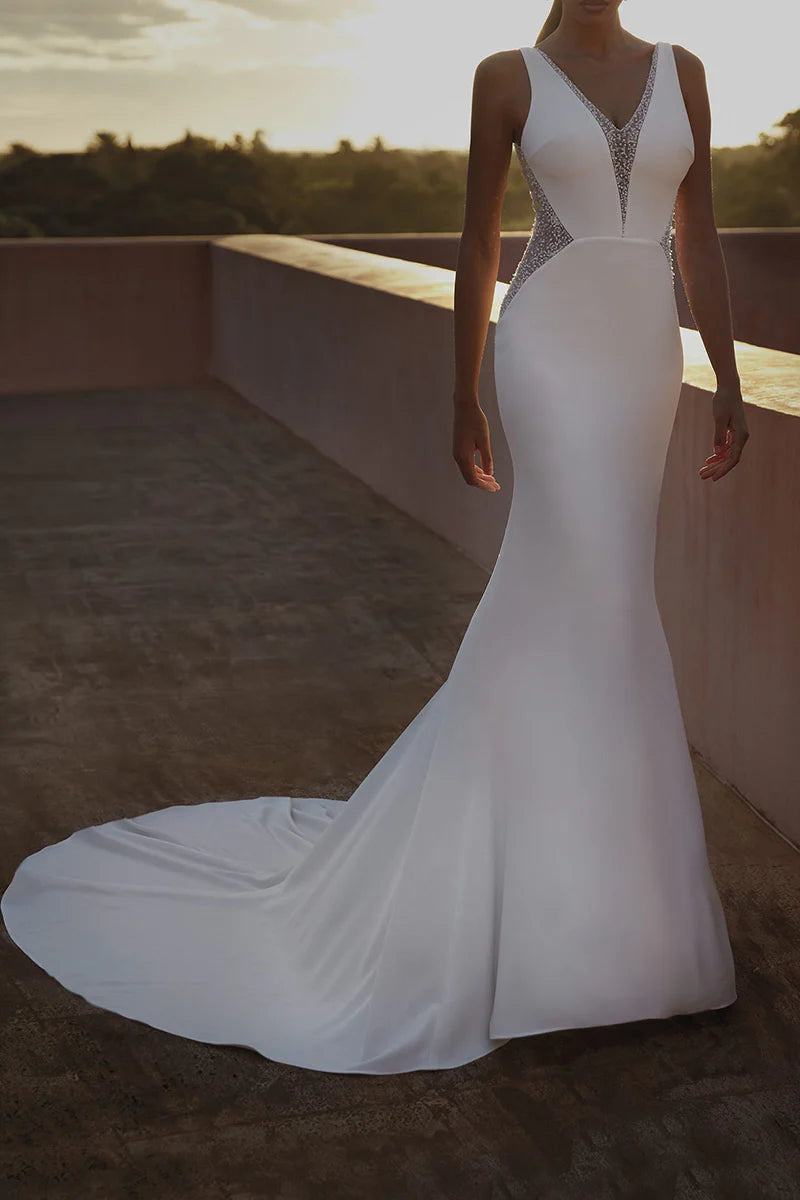 Back view of a mermaid wedding dress with a long court train.